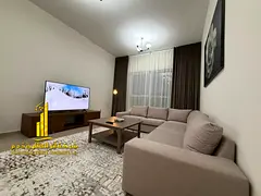 Two-bedroom apartment with a living room in Ajman - Corniche - Al Fazan Tower - furnished with hotel