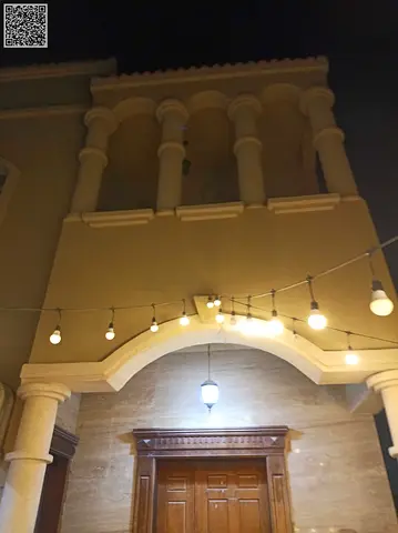 Corner villa for rent in Al Muwaihat 2. It consists of 5 master bedrooms, a living room, a majlis, 6 bathrooms, and a maid's room. The area is 5,000 sq. ft., fully serviced, and located near Sheikh Am