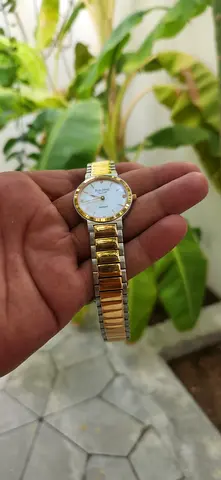 Ladies two-tone gold stainless steel wristwatch with white dial