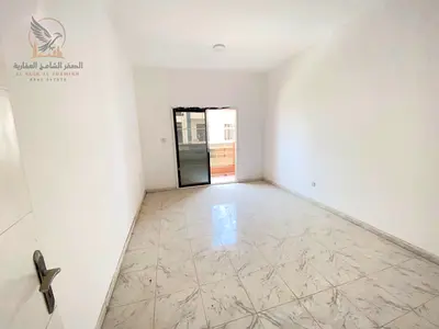 A renovated onebedroom apartment with a balcony and spacious living area ideally located on the DubaiSharjah exit and close to all amenities