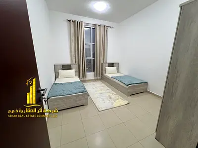 Luxurious two-bedroom apartment with a living room, fully furnished with brand new, high-end furniture, in a prime location with private parking.