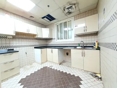 30 DAYS FREE 1BHK NEAR TO SCHOOLS ON ROAD BUILDING IN MUWAILEH