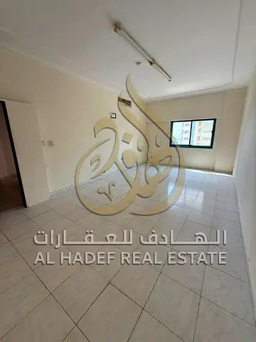 An apartment is available in Al Majaz featuring three bedrooms, a living room, a hallway, and a master bedroom. It includes central air conditioning,
