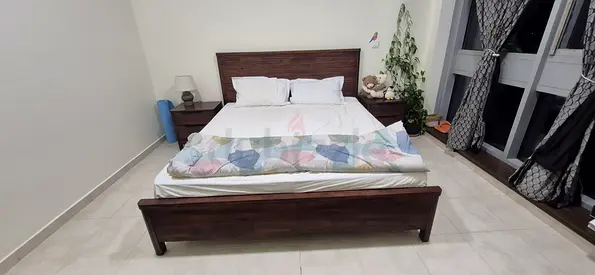 Solid neem wood double bed with matching nightstands and dresser + mattress from Royal Furniture.