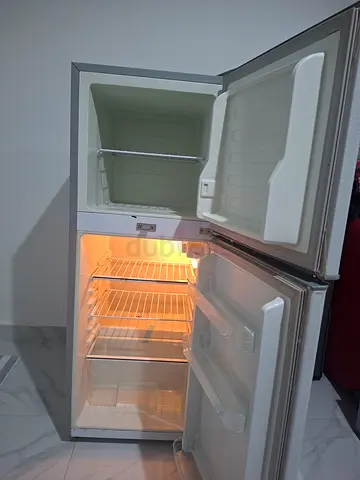 Small double-door refrigerator with top freezer — good working condition
