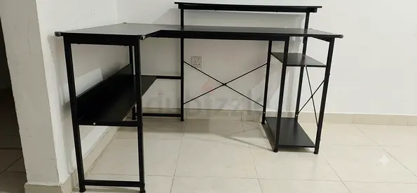 L-shaped black metal computer desk with shelves - good condition