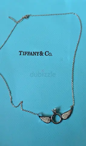 Silver-tone necklace with winged circle pendant (Tiffany & Co. style)