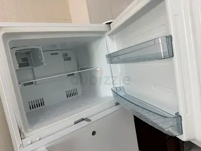 Small single-door refrigerator with freezer compartment - perfect working condition