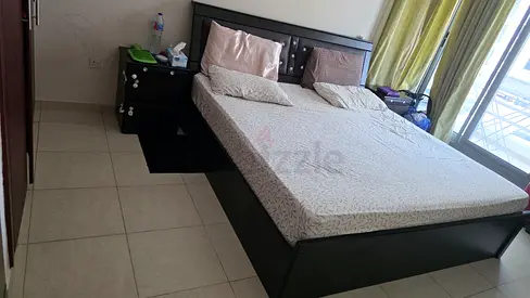 Super King size bed with mattress and two bedside tables and dressing table with mirror