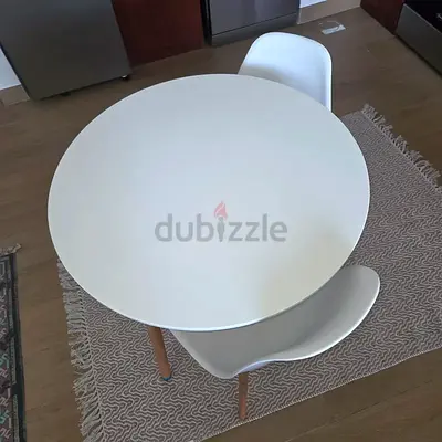 Round white dining table with 2 modern chairs - compact set
