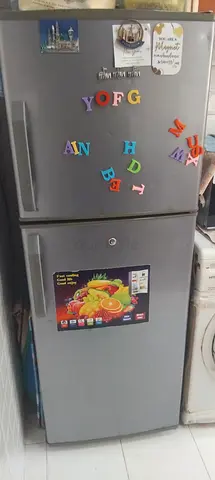 Used double-door refrigerator (top freezer) in working condition and washing machine