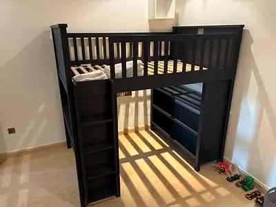 Dark wooden loft bunk bed with ladder and shelving - good condition