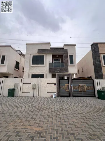 Villa for rent in Al Yasmeen, consisting of five master bedrooms, a majlis, a living room, a maid's room, a kitchenette, a storage room, and a balcony. Features central air conditioning, a carport, an