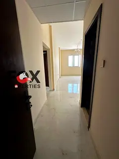 Two bedrooms and a living room for annual rent in Al Muwaihat 3 | Brand new building, first occupanc