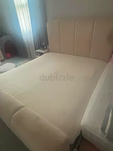 Beige Upholstered Double Bed with Headboard and Footboard