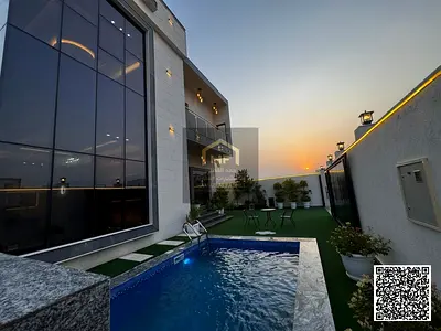 Luxury finished villa with a pool in Al Amra area, Ajman. The price includes electricity, water, and AC units. Land 4200 sq ft and building 4300 sq ft