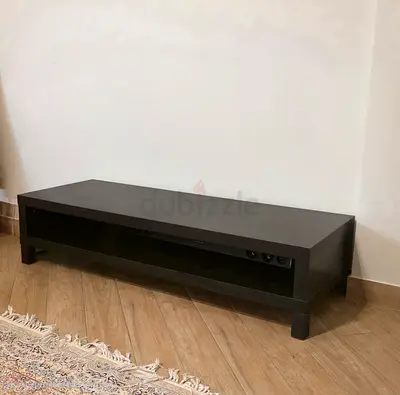 Low dark wood TV stand / media console with open shelf