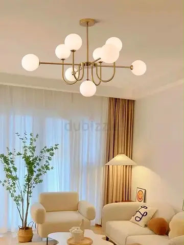 Modern Brass 9-Glass Globe Chandelier - Good Condition