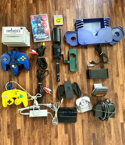 Mixed Nintendo accessories bundle — controllers, chargers, docks, cables, games