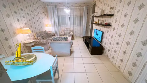 Luxury two-bedroom apartment with a living room and open balcony. Ajman One Tower. Fully furnished for monthly rent.