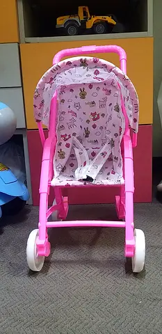 Lightweight pink toy baby stroller/pram for dolls - good condition