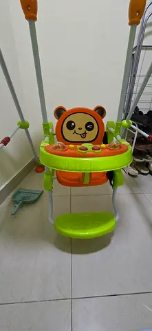 Baby swing with canopy and toy tray - good condition