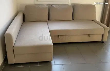 Beige L-shaped Sofa Bed with Storage - Good Condition