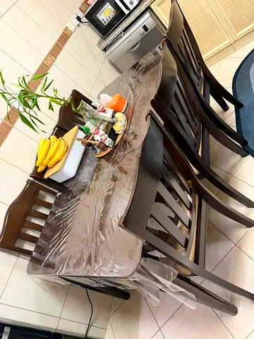Solid dark wood 6-seater dining table with chairs (good condition)