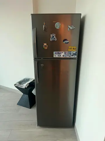 Silver two-door refrigerator in good working condition. Like new