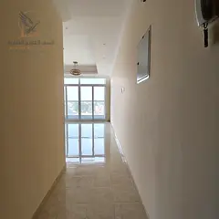 Annual apartment in Al Rawda, two bedrooms and living room, opposite Kanz Market, prime location nea