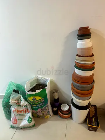 Assorted Garden Pots and Soil Supplies - Various Sizes