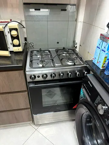 Stainless Steel 4-Burner Gas Stove with Oven - Used, Good Condition