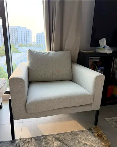 Light grey fabric armchair from ikea with cushion - modern single sofa