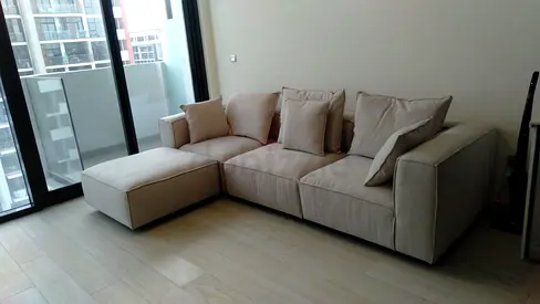 Light beige 3-seater L-shaped fabric sofa with ottoman - good condition