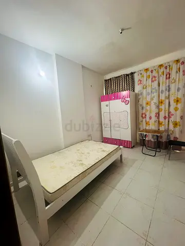 Sharing room available khalidiya family or couple