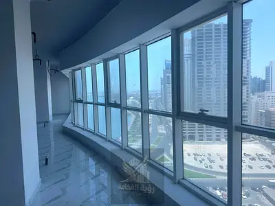 Annual commercial office for rent in Al Majaz 2 at Business Tower on Al Majaz Lake Corniche 1800 sq ft AED 85000 yearly 6 payments free AC parking and
