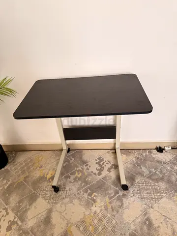 Small black folding study table with wheels - compact desk