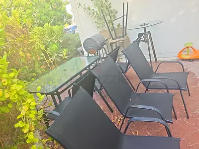 Out door dining set, BBQ machine and  A Bar table with 3 chairs   all for AED 350 only !