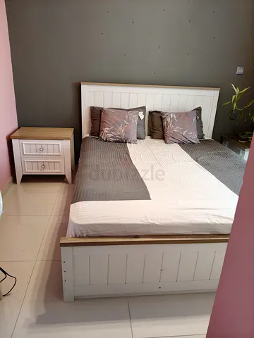 White wooden double bed with matching bedside table - good condition