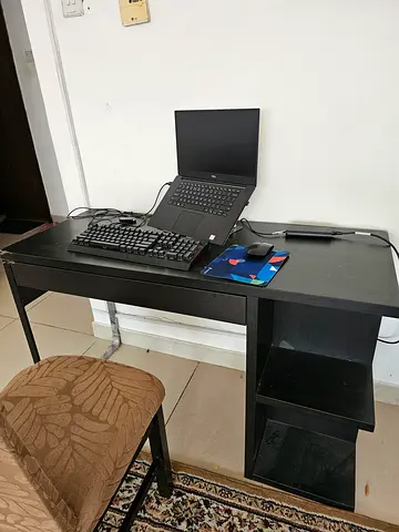 Compact black computer desk with open shelving — good condition