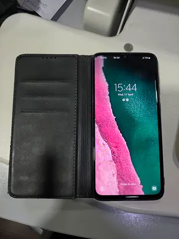 Used Samsung Galaxy A70 smartphone with flip wallet case - excellent working condition