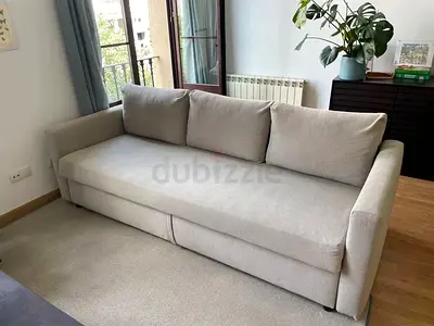 Beige 3-seater sofa bed in good condition
