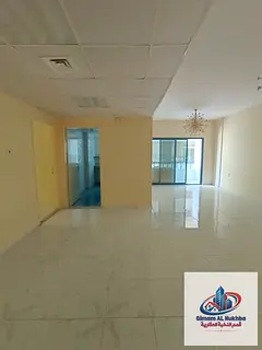 Spacious two-bedroom apartment in Al Majaz 3 with balcony, 2 bathrooms, built-in wardrobes and centr
