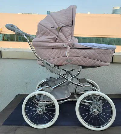 Classic vintage-style baby pram / bassinet stroller in pink