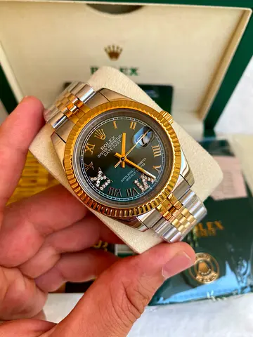This is a Rolex Datejust 41mm featuring a distinctive olive green dial with diamond-set Roman numera