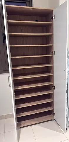 Tall white shoe cabinet with multiple shelves - excellent condition