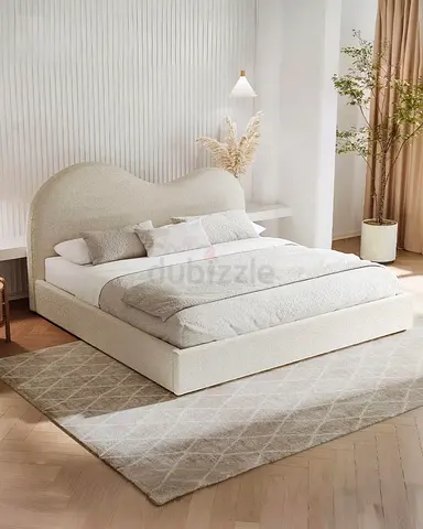 Modern upholstered queen bed with curved headboard - cream
