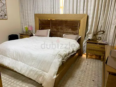King size bed frame with upholstered headboard and matching bedside tables