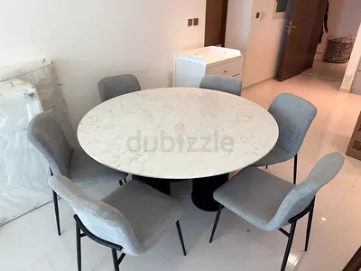 Round Marble-Top Dining Table with 6 Grey Fabric Chairs