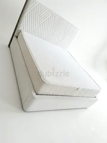 White upholstered bed frame with headboard and mattress - good condition